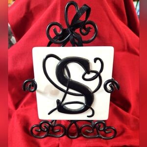 Decorative Tile with Black Letter S and Iron Stand